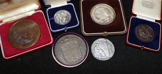 A collection of silver and base metal medallions